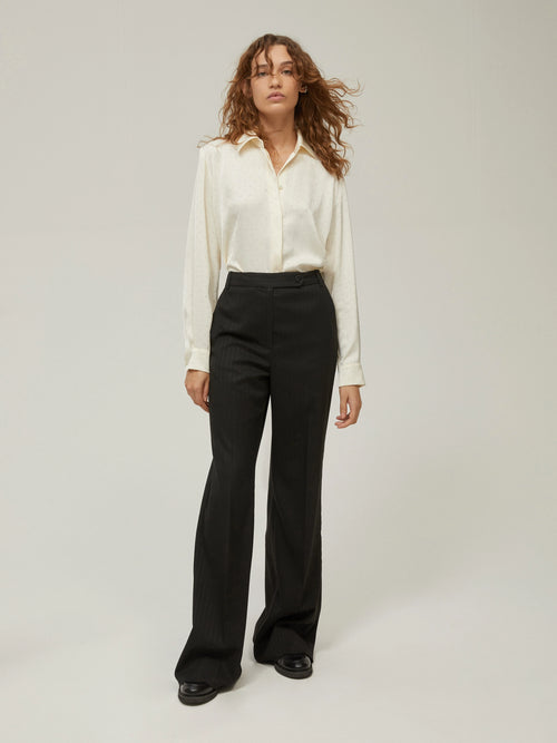 Pantaloni gessati con paillettes